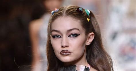 Gigi Hadid flashes nipples in completely sheer dress as she ...